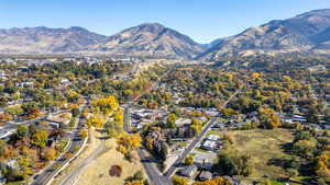 Aerial overview of property's location with mountains and nearby suburban area