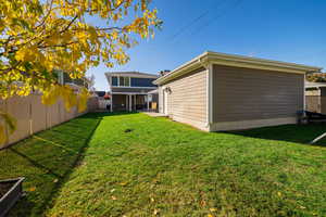 Fenced backyard with a patio area