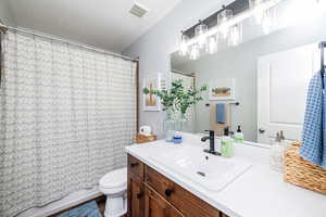 Bathroom featuring vanity and a textured ceiling