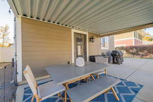 View of patio / terrace with outdoor dining area and a grill
