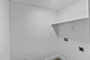 Laundry area featuring hookup for an electric dryer and hookup for a washing machine