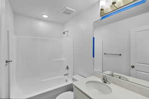 Full bath with shower / washtub combination and vanity