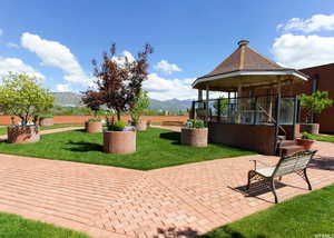 View of patio with a mountain view and a gazebo