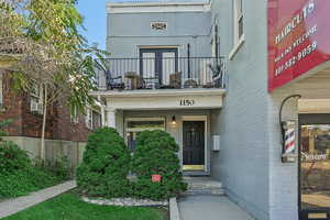 Doorway to property with brick siding