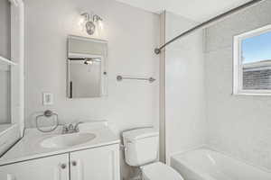 Bathroom featuring bathing tub / shower combination and vanity