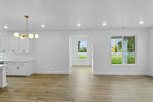 Unfurnished dining area featuring recessed lighting and light wood finished floors