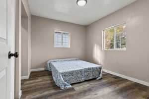 Bedroom with dark wood finished floors