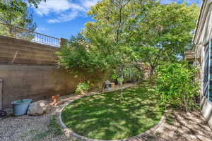Fenced backyard with a patio area