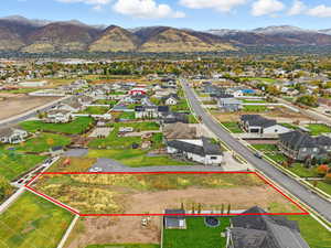 Aerial view of property's location with property parcel outlined and mountains