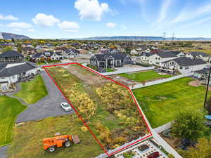 Aerial perspective of suburban area with mountains and property boundaries highlighted