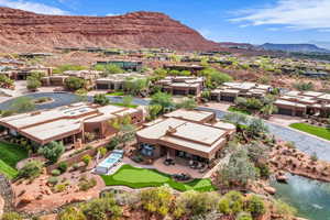 Aerial perspective of suburban area with a mountainous background