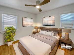 Bedroom featuring light wood-style flooring and ceiling fan