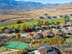 Aerial view of residential area featuring a mountainous background