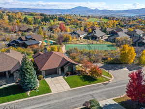 Aerial perspective of suburban area with a mountainous background