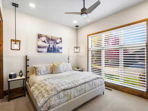 Bedroom with carpet, ceiling fan, and recessed lighting