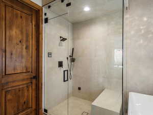 Full bath featuring a shower stall