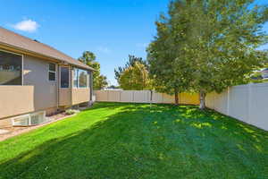 View of fenced backyard
