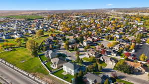 Aerial view of property's location featuring nearby suburban area