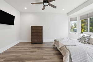 Bedroom with recessed lighting, light wood-style flooring, and a ceiling fan