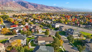 Aerial view of residential area featuring a mountain backdrop