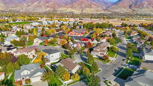 Aerial view of residential area featuring a mountainous background