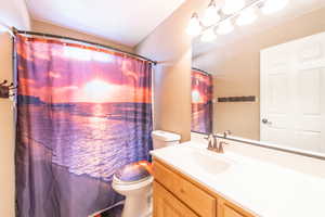 Bathroom with vanity and toilet