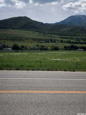 View of mountain background featuring rural landscape