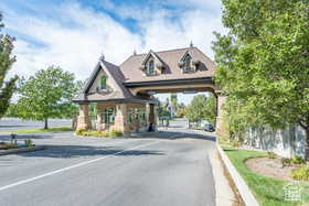 View of asphalt road with curbs