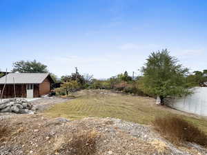 View of yard with an outbuilding