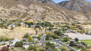 Aerial view of residential area featuring a mountainous background