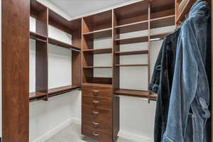 Primary bedroom walk-in closet