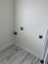 Laundry area featuring hookup for an electric dryer and washer hookup