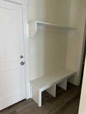 Mudroom featuring dark wood-style floors