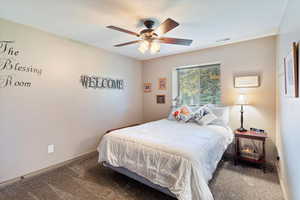 Bedroom with carpet floors and ceiling fan