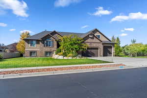 View of front of property featuring driveway and a garage