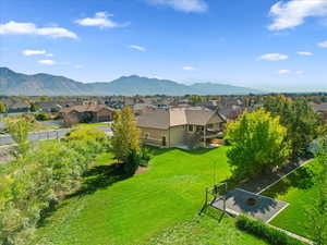 Aerial view of residential area featuring a mountain backdrop