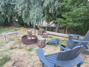 View of yard featuring an outdoor fire pit