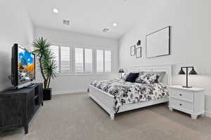 Bedroom featuring light carpet, recessed lighting, and a ceiling fan