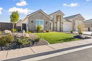 Ranch-style house featuring concrete driveway, a garage, and board and batten siding