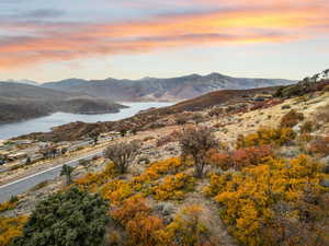 View of mountain backdrop featuring a large body of water