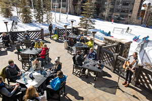 Snow covered patio with a patio