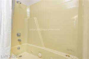Full bathroom with shower / bath combo with shower curtain