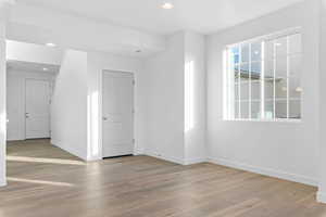 Empty room featuring recessed lighting and light wood-style flooring