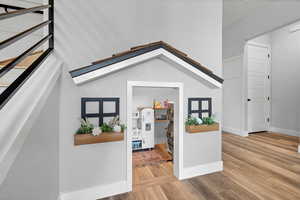 Entrance foyer featuring stairway and wood finished floors