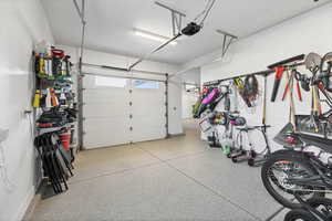 Garage featuring a garage door opener