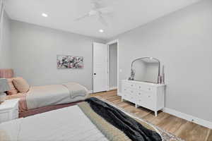 Bedroom with recessed lighting, light wood-type flooring, and a ceiling fan