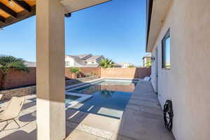 View of pool with a fenced backyard, a patio, and a residential view