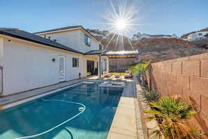 View of pool featuring a fenced backyard and a patio area