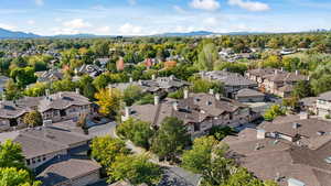 Aerial view of residential area featuring a mountainous background