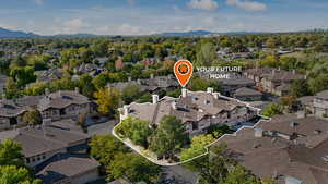 Aerial view of residential area with a mountainous background